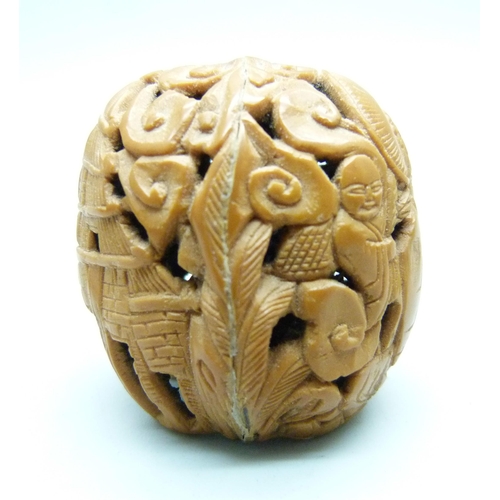 810 - A Cornish Serpentine carved model frog, a carved walnut with Buddha detail, a/f, and a Japanese scre... 