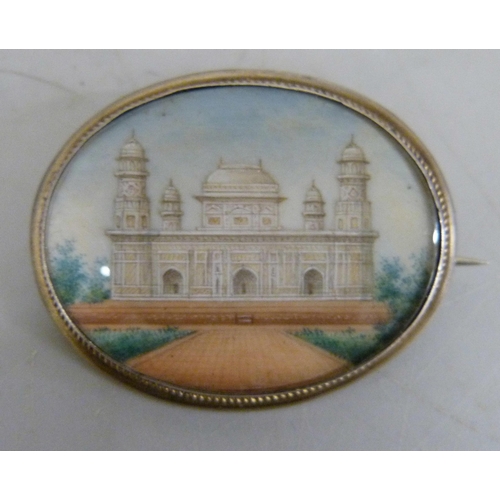 819 - A 19th Century Indian miniature on card, framed and hand painted, a 19th Century miniature brooch de... 