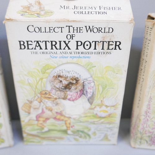 850 - A collection of Beatrix Potter books and ten Beatrix Potter 50p coins