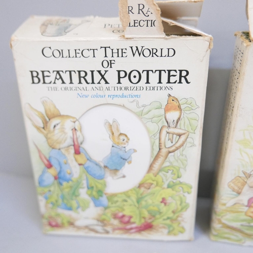 850 - A collection of Beatrix Potter books and ten Beatrix Potter 50p coins