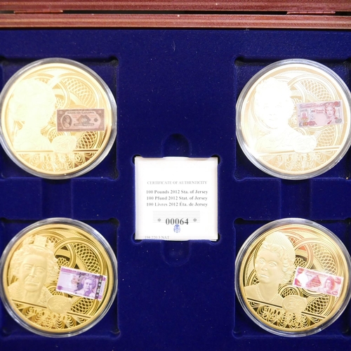 860 - A presentation box of four large coins, Queen Elizabeth II banknotes, a box of Centenary WWI coins (... 