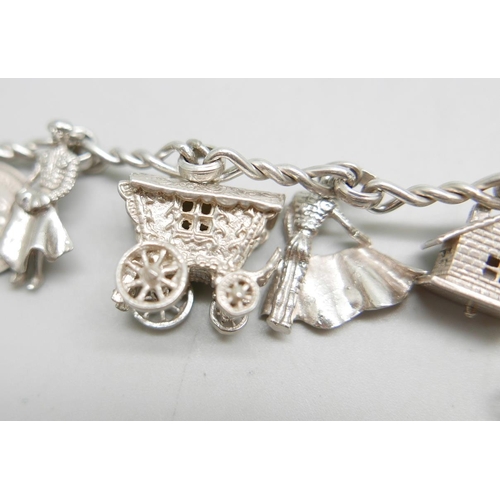 863 - A silver charm bracelet, 47g