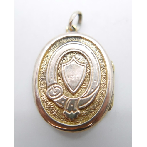 866 - A locket with applied gold and enamelled detail, 22mm wide, marked 9ct