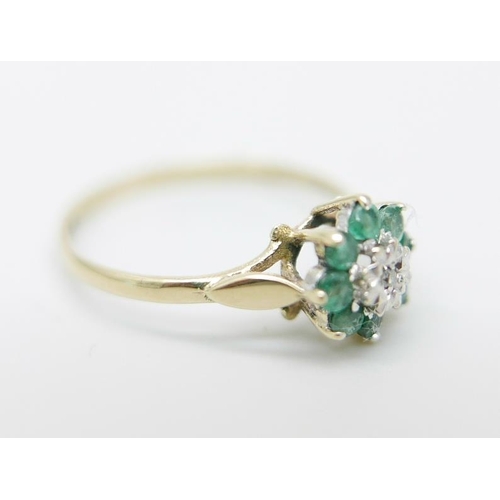 874 - A 9ct gold, emerald and diamond cluster ring, 1.1g, L/M