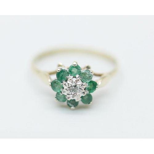 874 - A 9ct gold, emerald and diamond cluster ring, 1.1g, L/M