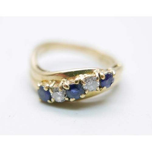 876 - An 18ct gold, sapphire and diamond five stone ring, 5g, M