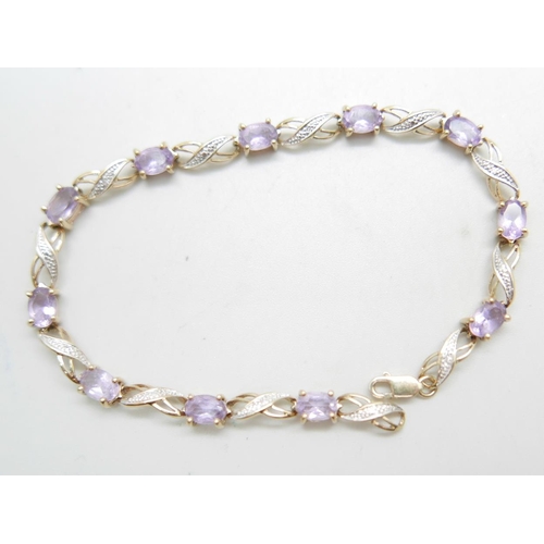 879 - A 9ct gold, amethyst and diamond bracelet, 6.6g,  19cm