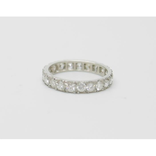 886 - A platinum and diamond eternity ring, 3g, L, (marked plat on side)