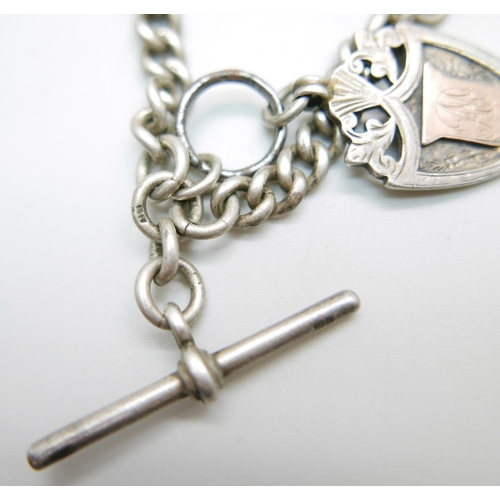 926 - A c1900 sterling silver Albert chain with T-bar and silver fob medal, 'Burton Cage Bird Society, 191... 