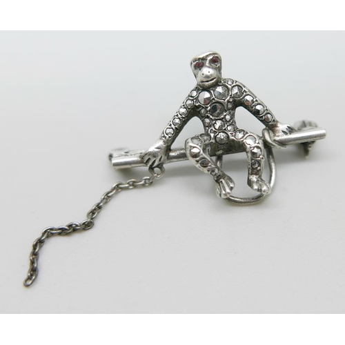 932 - An 835 silver and marcasite set monkey brooch