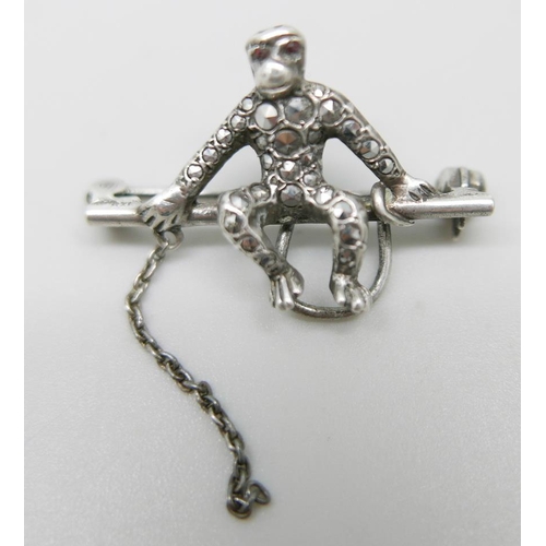 932 - An 835 silver and marcasite set monkey brooch