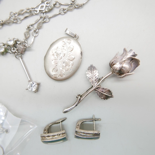 935 - A silver locket, a pair of Celtic earrings, a silver rose brooch, etc., (necklace requires fastener)