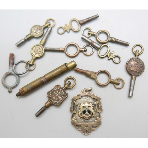 936 - Watch keys including advertising and a gold front silver enamel fob