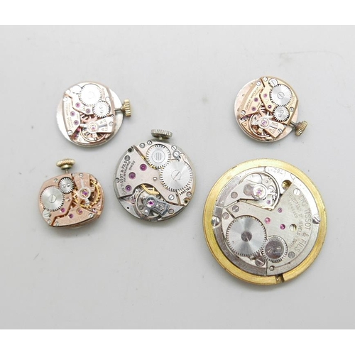 937 - Three lady's Omega wristwatch movements, a lady's Tissot movement and gentleman's Tissot movement, (... 