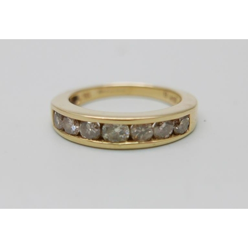 950 - An 18ct gold and seven stone diamond ring, one carat total diamond weight marked on the shank, 6g, P