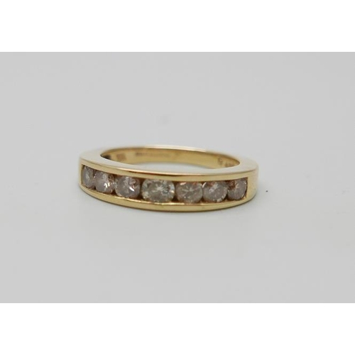 950 - An 18ct gold and seven stone diamond ring, one carat total diamond weight marked on the shank, 6g, P