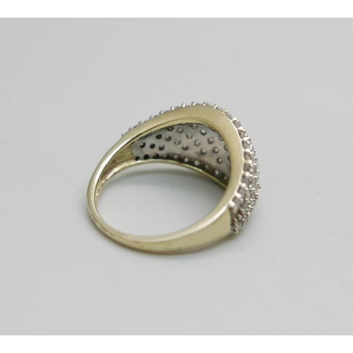 954 - A 9ct gold and diamond ring, 3.7g, L