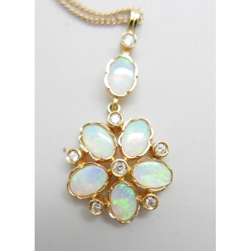 958 - A 9ct gold, opal and diamond pendant on a fine 9ct gold chain, 4.2g, chain 50cm