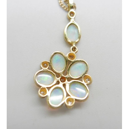 958 - A 9ct gold, opal and diamond pendant on a fine 9ct gold chain, 4.2g, chain 50cm