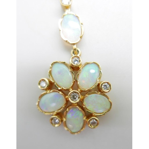 958 - A 9ct gold, opal and diamond pendant on a fine 9ct gold chain, 4.2g, chain 50cm