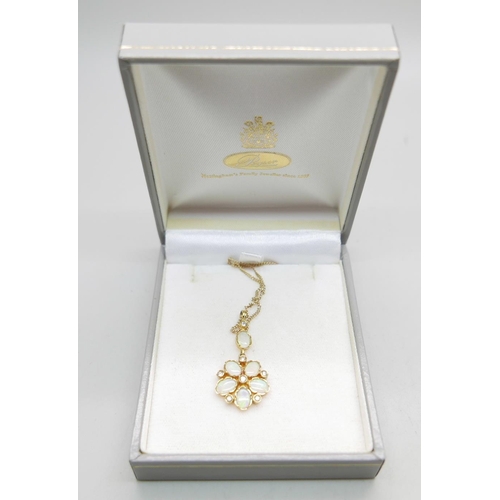 958 - A 9ct gold, opal and diamond pendant on a fine 9ct gold chain, 4.2g, chain 50cm