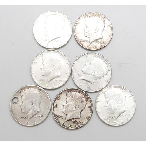 966 - Seven 900. silver 1964 Liberty Kennedy half-dollar coins, 86.9g, one drilled