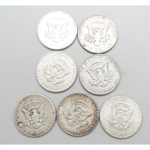 966 - Seven 900. silver 1964 Liberty Kennedy half-dollar coins, 86.9g, one drilled