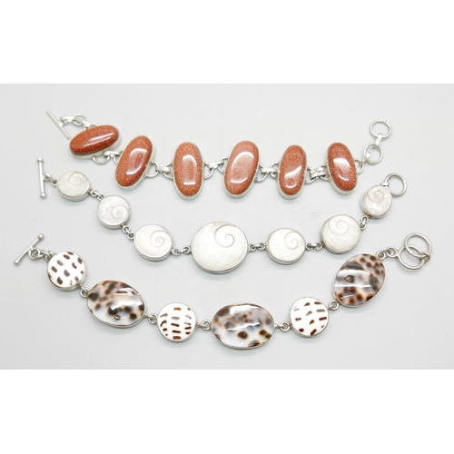 969 - Three stone set white metal bracelets