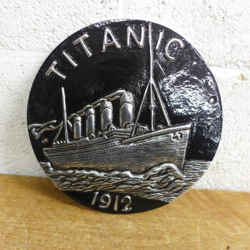 2110 - A round aluminium Titanic plaque * this lot is subject to VAT