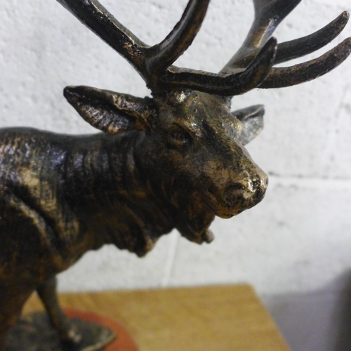 2141I - A cast stag figure with wooden base * this lot is subject to VAT