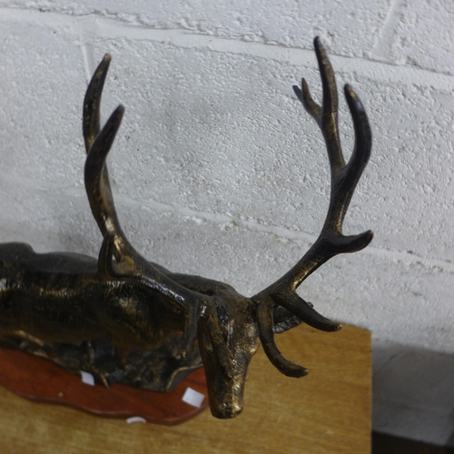 2141I - A cast stag figure with wooden base * this lot is subject to VAT