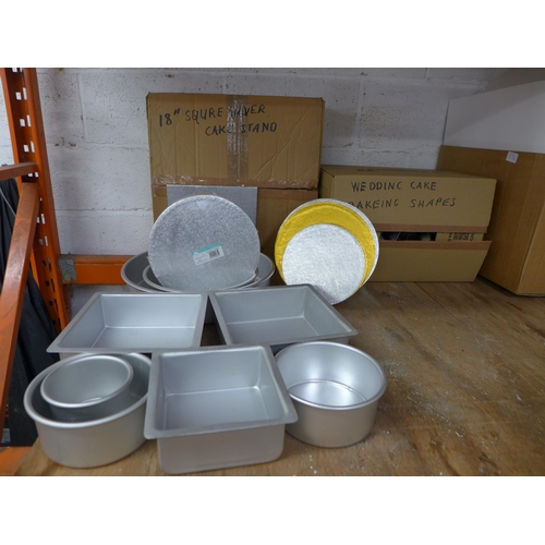 2236 - A large amount of cake making equipment including - cake tins, cake stands, food boxes, cake shapes,... 