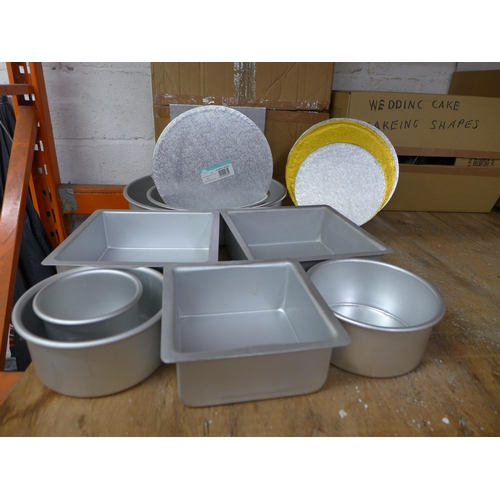 2236 - A large amount of cake making equipment including - cake tins, cake stands, food boxes, cake shapes,... 