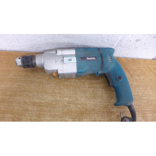 2008 - A Makita HP2032 110v rotary hammer drill with 6 drill bits in case