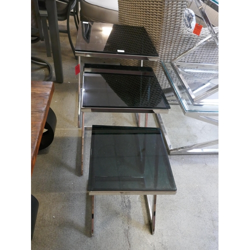 1508 - A chrome and black glass nest of three tables -Boxed *This lot is subject to VAT