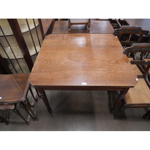 141 - A Victorian oak kitchen table