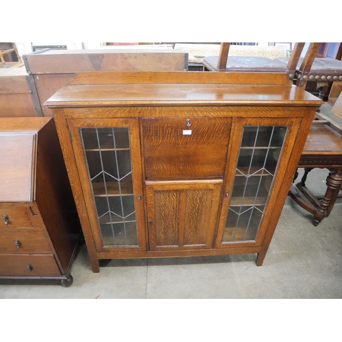 152 - An early 20th Century oak side by side bookcase