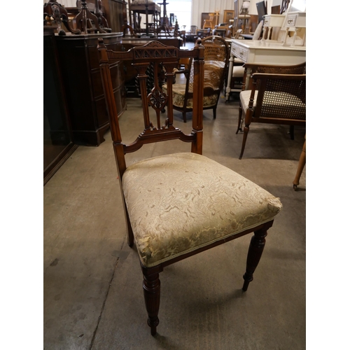 188 - A set of four Edward VII carved walnut dining chairs