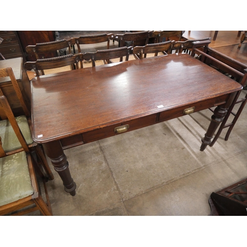 169 - A Victorian mahogany two drawer library table