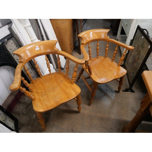79 - A pair of Victorian style beech smokers bow chairs