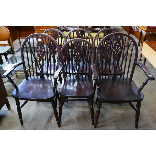 117 - A set of six beech wheelback kitchen chairs