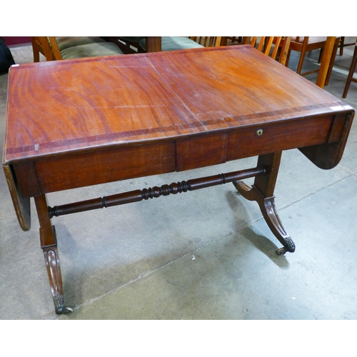 127 - A George IV mahogany sofa table with rosewood crossbanding