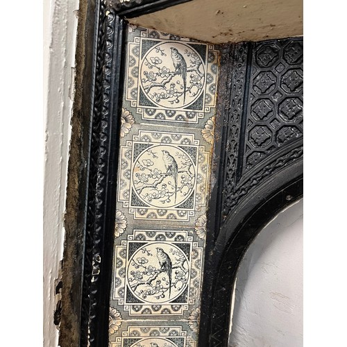 210 - A Victorian slate fire surround with cast iron tiled insert