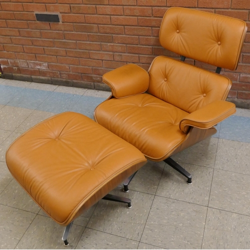 1 - A Charles & Ray Eames style simulated rosewood and tan leather revolving lounge chair and ottoman