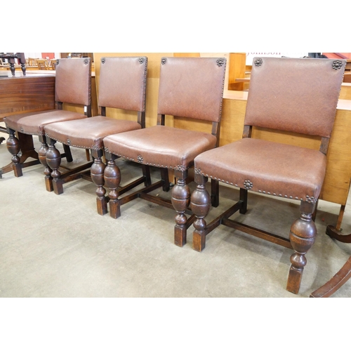 128 - A set of four oak dining chairs