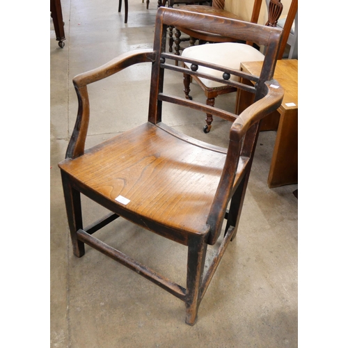 161 - A 19th Century elm elbow chair