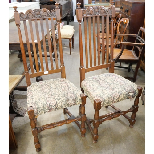 162 - A pair of carved oak dining chairs