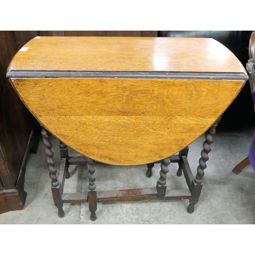 163 - An oak barleytwist gateleg table