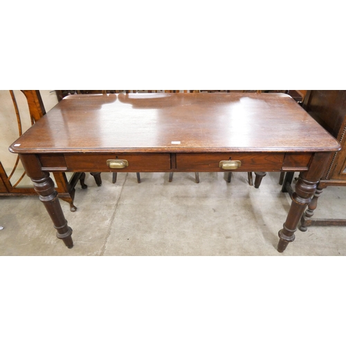 169 - A Victorian mahogany two drawer library table
