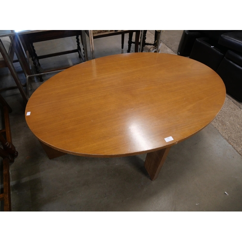 183 - A teak oval coffee table